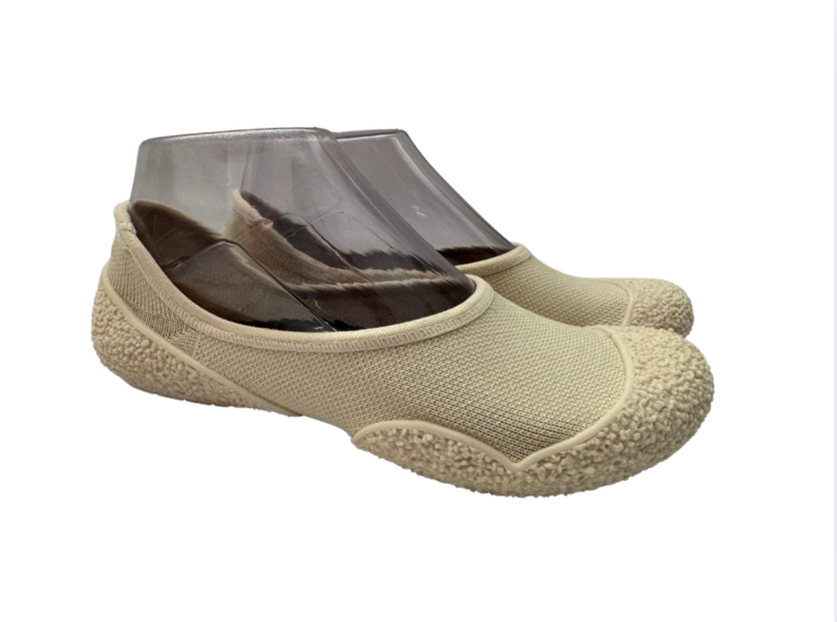 Pair of beige textured sole minimalist shoes