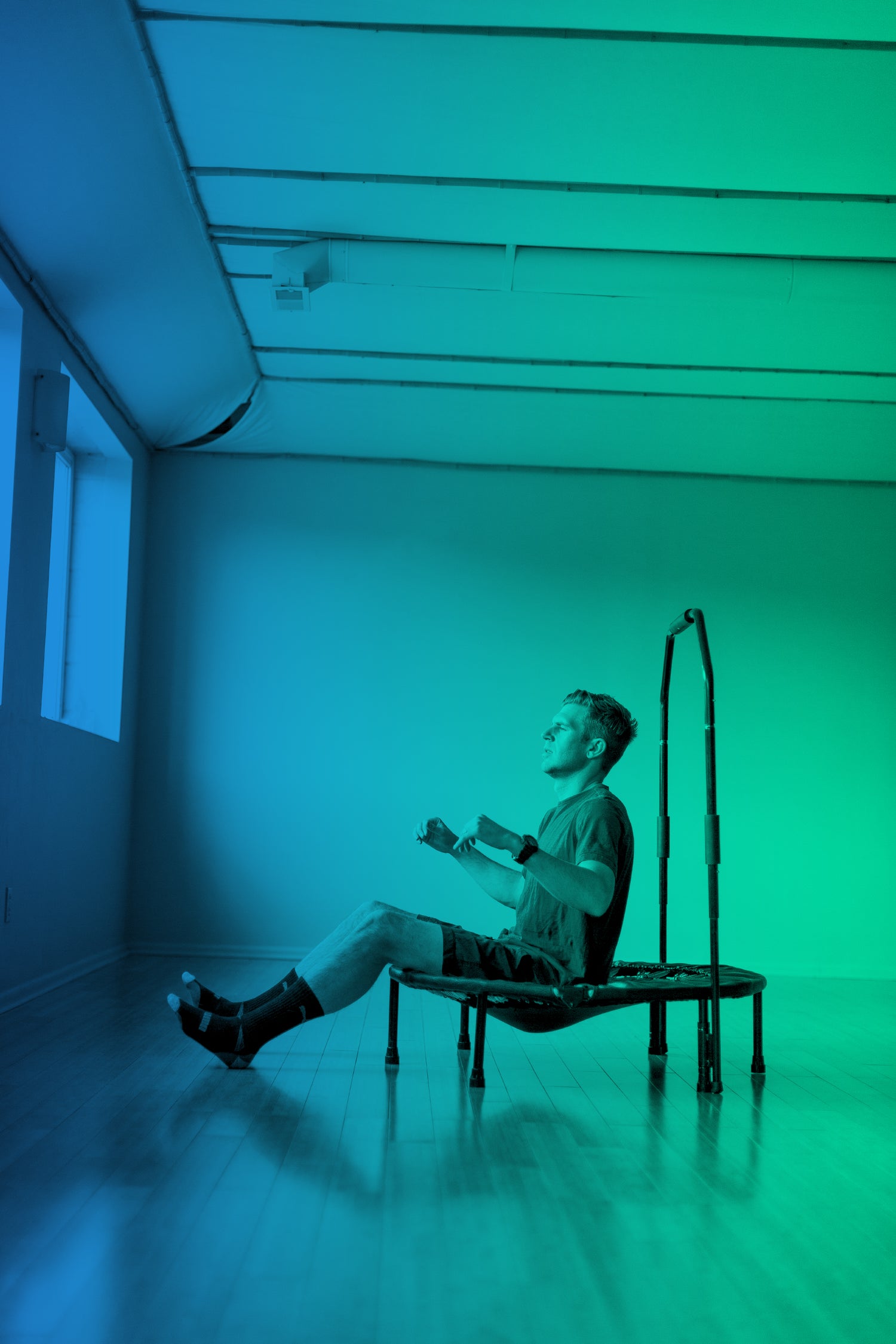 Sit and Bounce Feet on the Ground Man with Blue and Green Gradient Cellercise